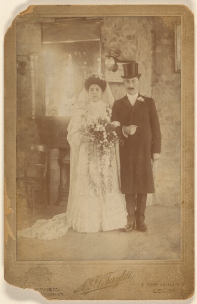 A. & G. Taylor, [Portrait of a wedding couple, standing]