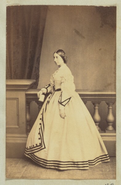 Unknown, [Portrait of woman in dress with black accents]