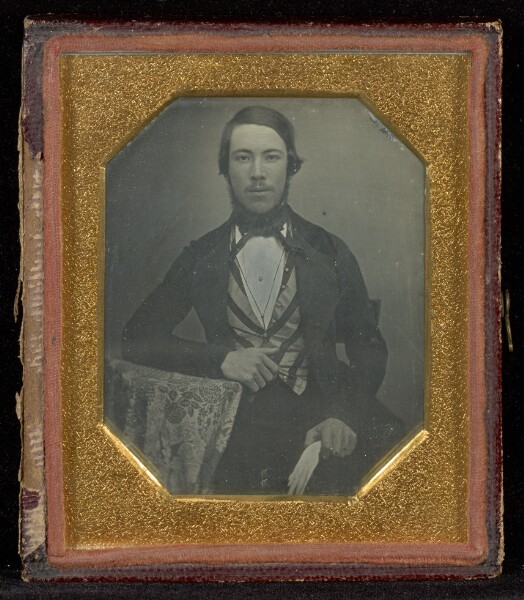 Unknown, [Portrait of a Man at a Table]