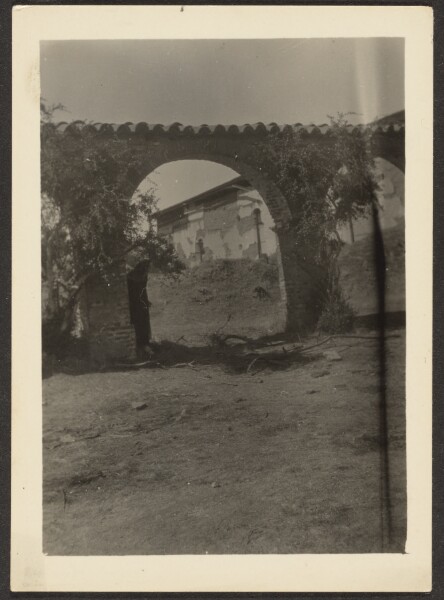 Louis Fleckenstein, [Figure Standing in Mission Archway]