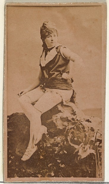 W. Duke, Sons & Co., [Actress in studio posing on prop boulder], from the Actors and Actresses series (N145-8) issued by Duke Sons & Co. to promote Duke Cigarettes