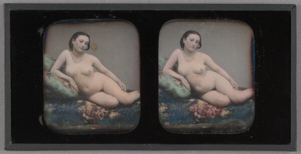 Unknown, [Female nude reclined on couch with pillows]