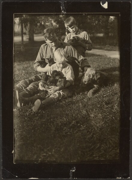 Louis Fleckenstein, [Man with Children and Puppies in Yard]