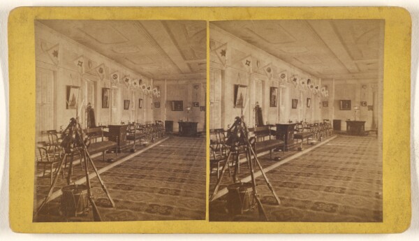 Unknown, [Interior with guns piled in a pyramid with a drum underneath]