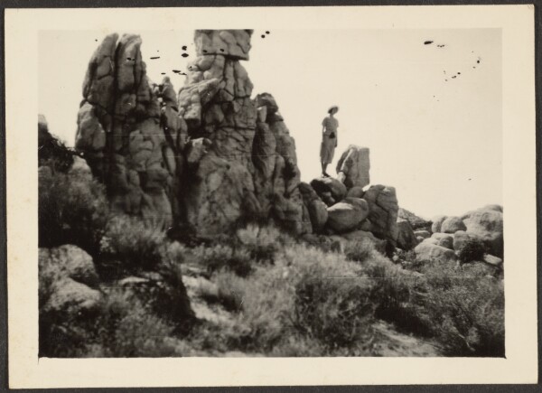Louis Fleckenstein, [Woman Standing on Rocks]