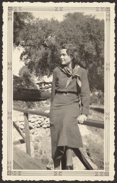 Louis Fleckenstein, [Snapshot of Woman Leaning on Bridge Rail]