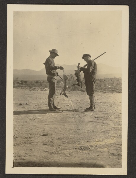 Louis Fleckenstein, [Fleckenstein and Man Holding Guns and Dead Jackrabbits]