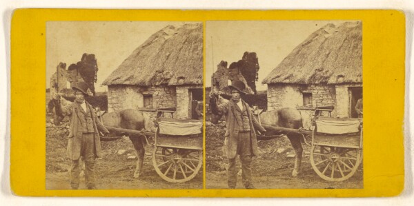 Unknown, [Unidentified man wearing a hat which is cockeyed on his head standing near a horse and wagon, holding a thin whip in his hand.