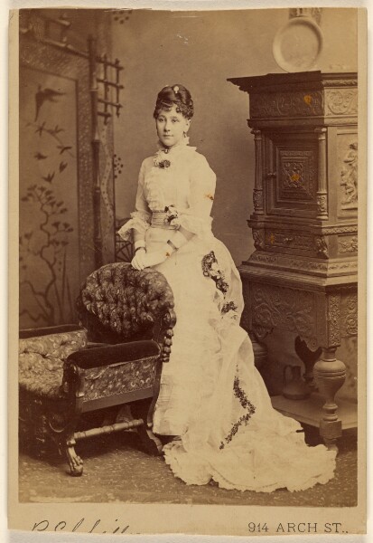Unknown, [Woman in long white dress, standing]