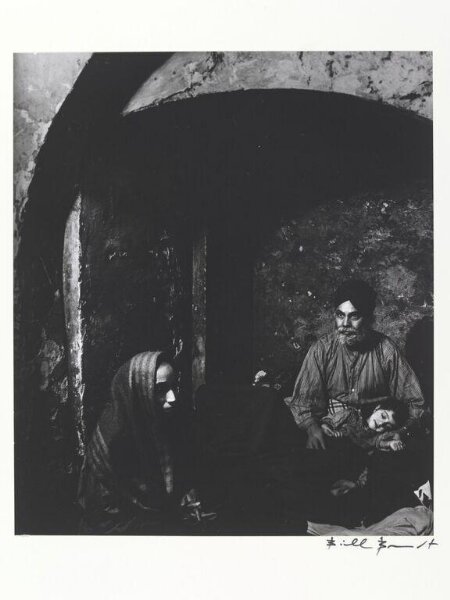 Bill Brandt, A Sikh Family Sheltering in an Alcove, Christ Church, Spitalfields