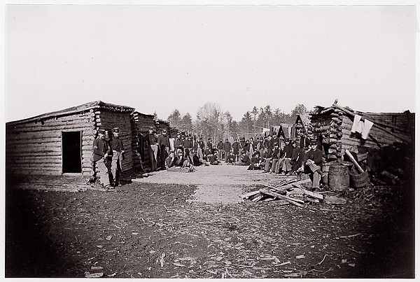 Unknown, [Winter Quarters, troops with row of cabins].  Brady album, p. 128