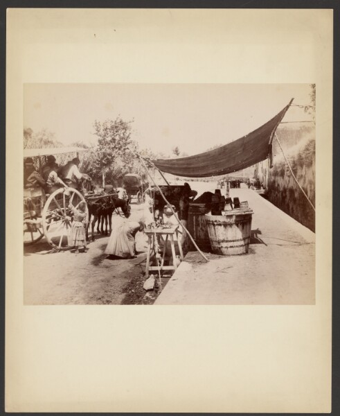 Unknown, [Street scene with street vendor]