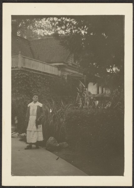 Louis Fleckenstein, [Woman Outside House]