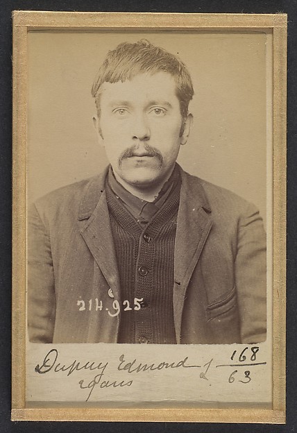 Alphonse Bertillon, Dupuy. Edmond, Adolphe. 29 ans, né à Paris XIVe. Employé de commerce. Anarchiste. 1/3/94.