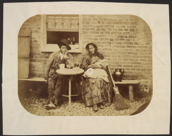 Unknown, [Man and woman sitting at table]