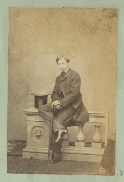 Unknown, [Portrait of young man sitting on baluster]
