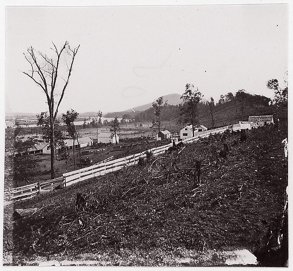 Unknown, [White picket fence with buildings in background].  Brady album, p. 123