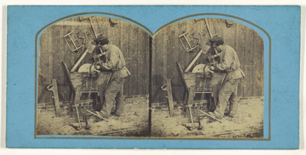 Unknown, [Man sharpening blade on foot-operated whetstone]