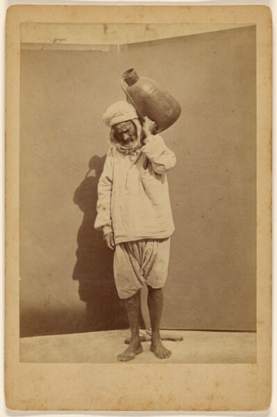 Unknown, [Arab man carrying a jug]