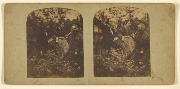 London Stereoscopic and Photographic Company, [Two men and a woman in a wooded area, one man is holding a pewter mug, the other man is smoking a long-stemmed pipe]