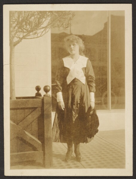 Louis Fleckenstein, [Woman Standing on Sidewalk]