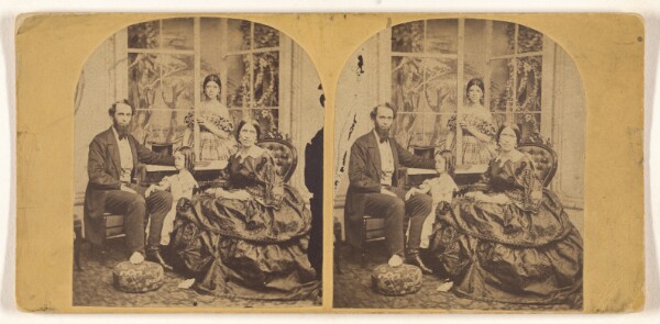 Unknown, [Family posed in a studio]