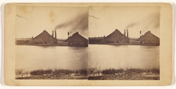 Unknown, [Factory near a river]