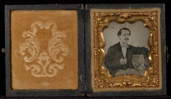 Unknown, [Portrait of a Man Seated at a Table with His Elbow Propped on Books]