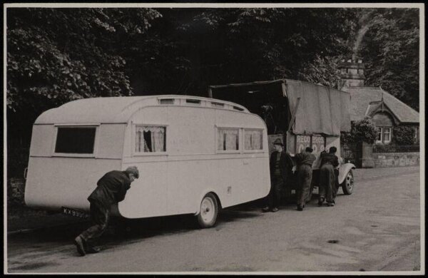 Hinde, John Wilfrid, view of a truck and caravan being pushed