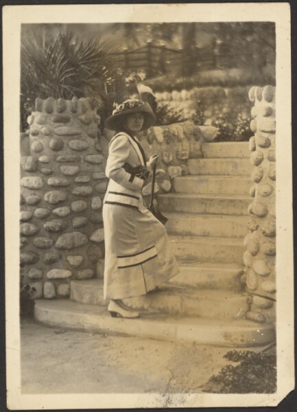 Louis Fleckenstein, [Woman with Camera on Steps]