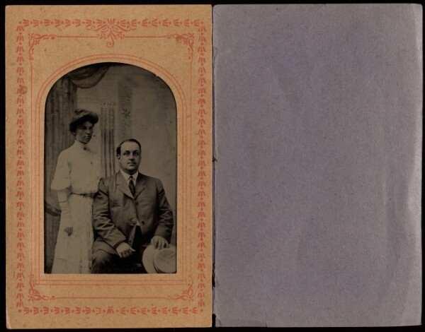Unknown, [Unidentified couple: woman standing, man seated holding a hat]
