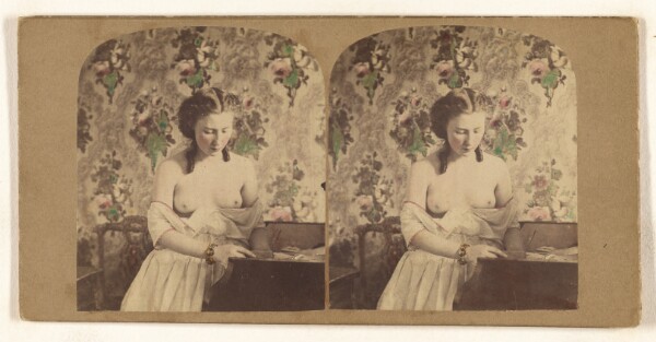 Unknown, [Bare-breasted woman looking down]