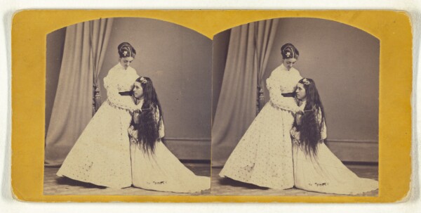 Unknown, [Woman standing, combing long hair on another woman kneeling]