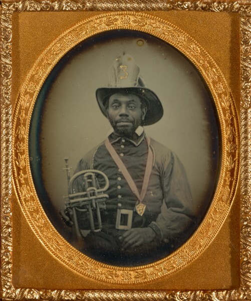 Unknown, [Black Fireman in Uniform Holding a Brass Horn]