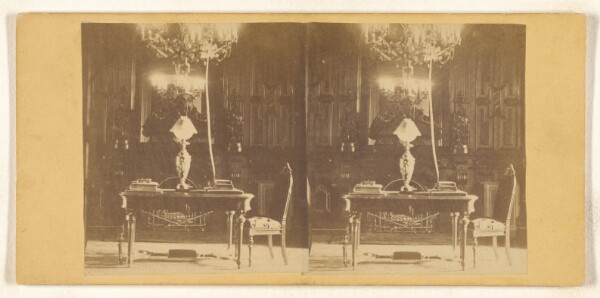 Unknown, [Interior of a study, ornate table with lamp and books on top]