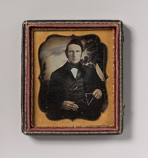 Unknown, [Man Holding Glasses in Front of Painted Outdoor Backdrop]