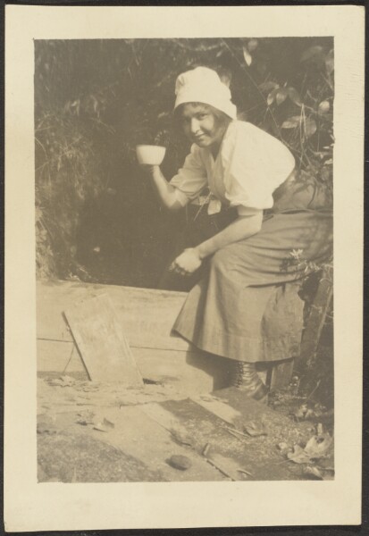 Louis Fleckenstein, [Woman in Garden with Tea Cup]