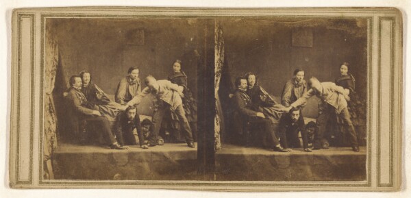 Unknown, [Stage scene: group of seven, two on the floor, one standing who is blindfolded]