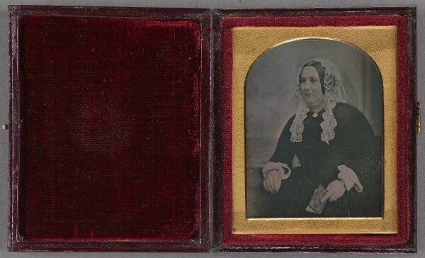 Unknown, [Portrait of a middle-aged woman in veil seated, holding a book]