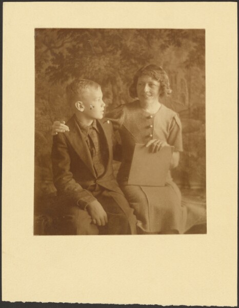Louis Fleckenstein, [Woman and Young Man Seated Before Tapestry]