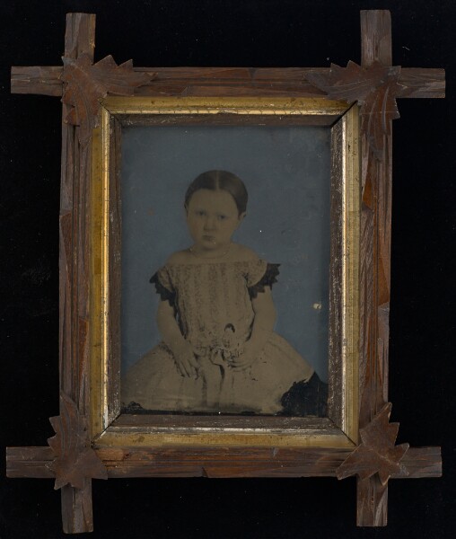 Unknown, [Portrait of young girl with doll]