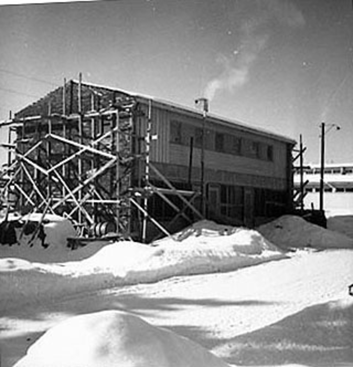 Anno Domkirkeodden, EKSTERIØR: BROVOLDS BYGG UNDER BYGGING, VINTER, SKOLEGATA. , STANGEBYEN