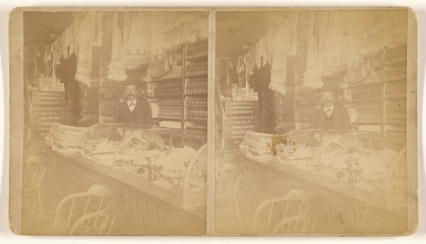 Unknown, [Interior of a country store, man at front counter]