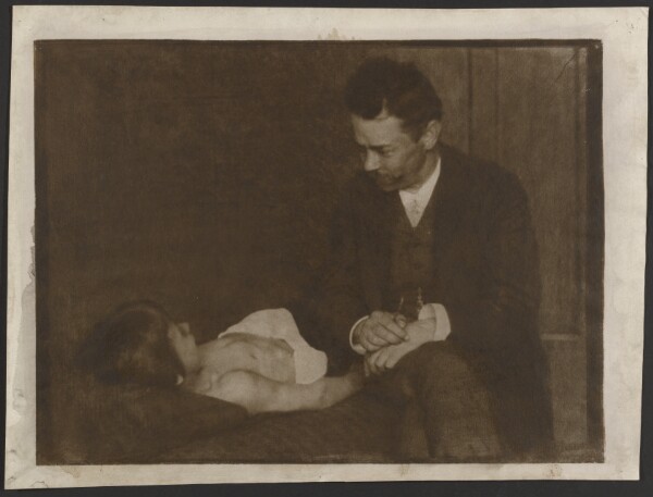 Heinrich Kühn, [Man Seated Beside Supine Child]