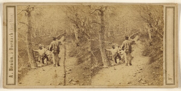 Adolphe Braun, [Two men on a forest path with barren trees]