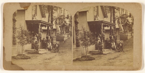 Unknown, [Fanily portrait posed on front porch of house]
